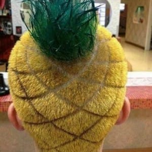 Image of a man with a barbering pineapple hair cut and colour