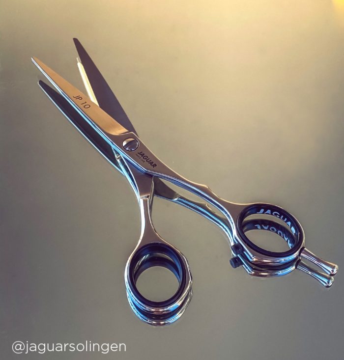 Jaguar JP10 hairdressing scissor on reflective background from @jaguarsolingen