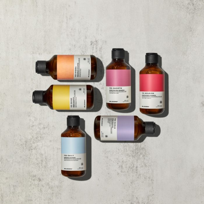 Elgon Yes haircare shampoo collection on a light grey concrete background