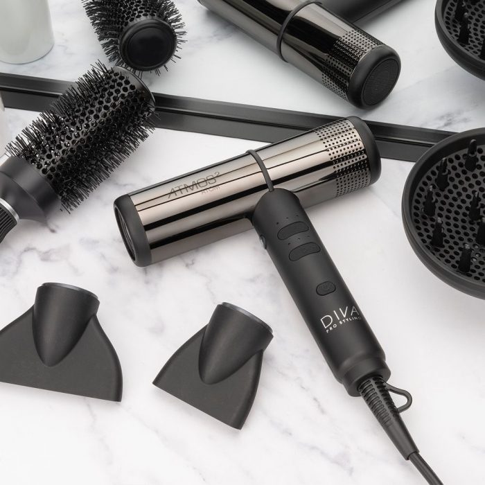 Diva Pro Atmos 2 Atom hair dryer on a marble background with drying attachments reflected in a mirror