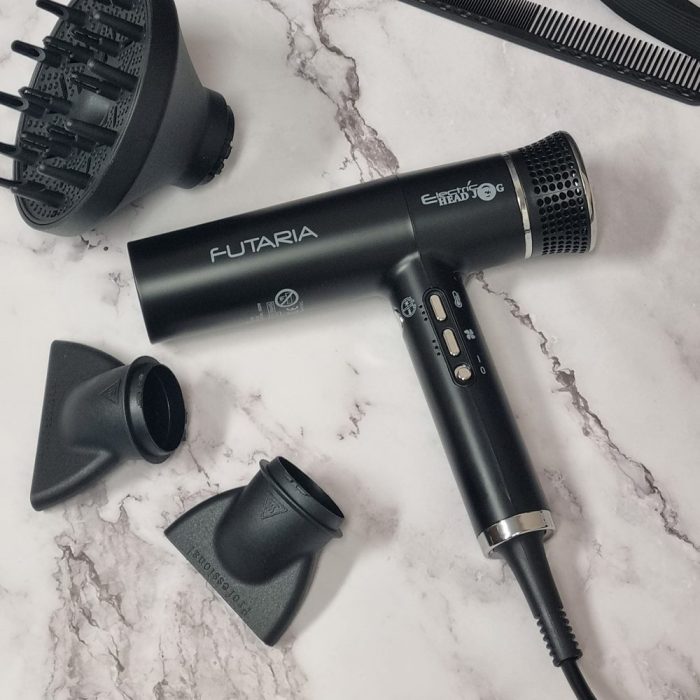 Electric Head Jog Futaria hair dryer black with nozzles and diffuser on a marble background