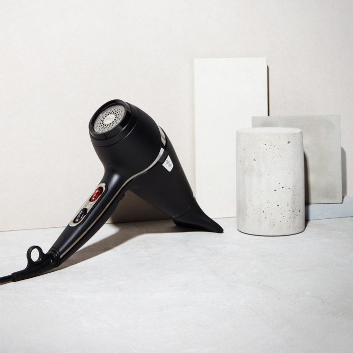 ghd air hair dryer with neutral concrete background