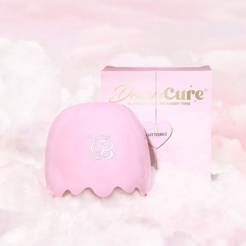Glitterbels DreamCure nail lamp with box on a background of pink clouds