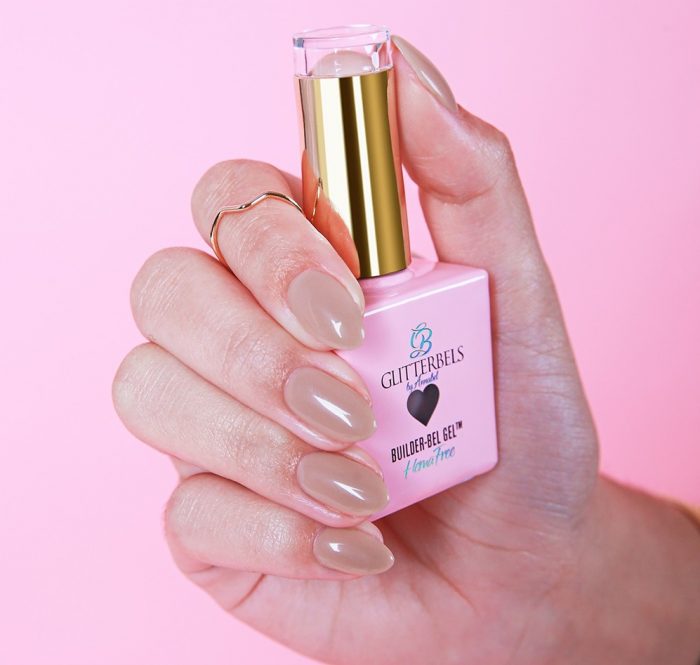Glitterbels Builder Bel hema-free builder gel in hand on a pink background
