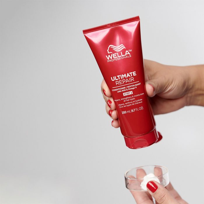 image of wella conditioner in hand