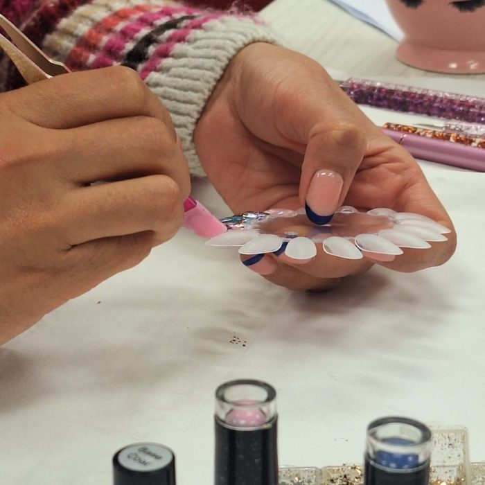 shows student working on design during course