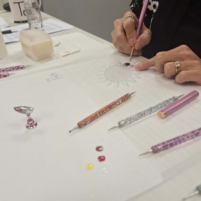 shows student on nail art course