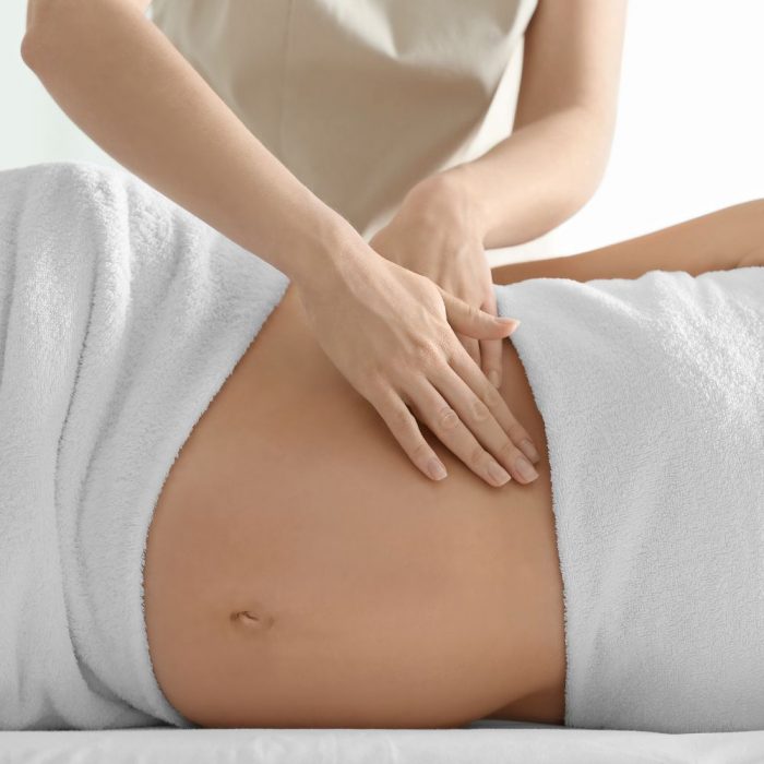 pregnant woman having a pregnancy massage