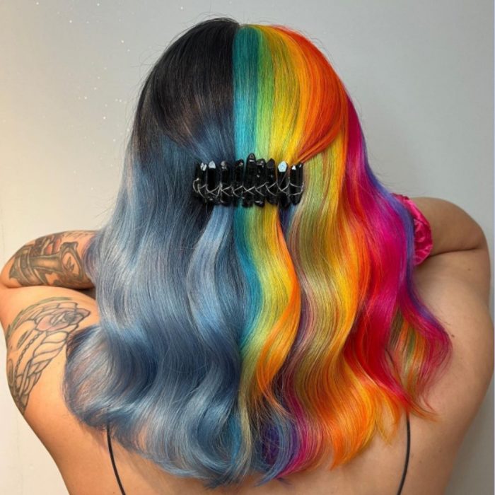 woman showing vivid rainbow hair