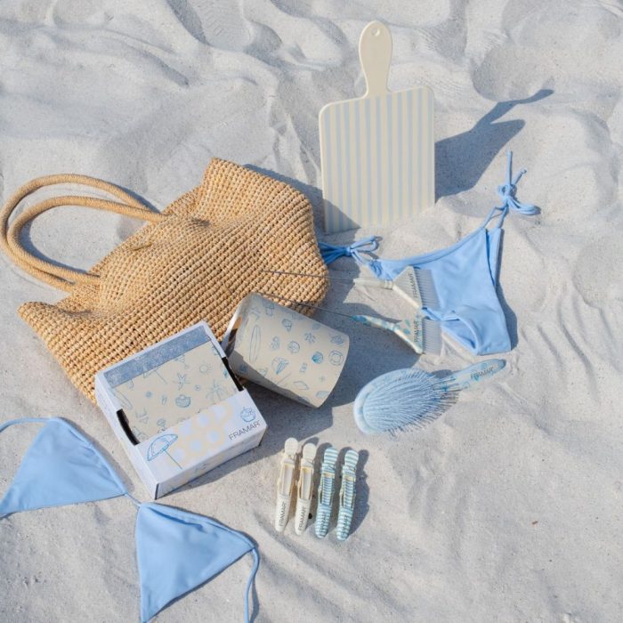 beach bum collection with beach bag and bikini on the beach