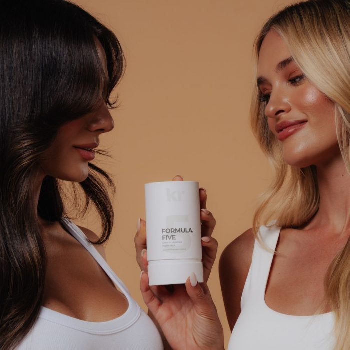 two women holding keratin revolution formula five