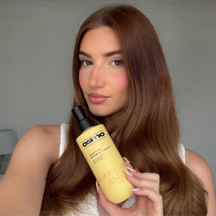 model holding the guardian angel spray