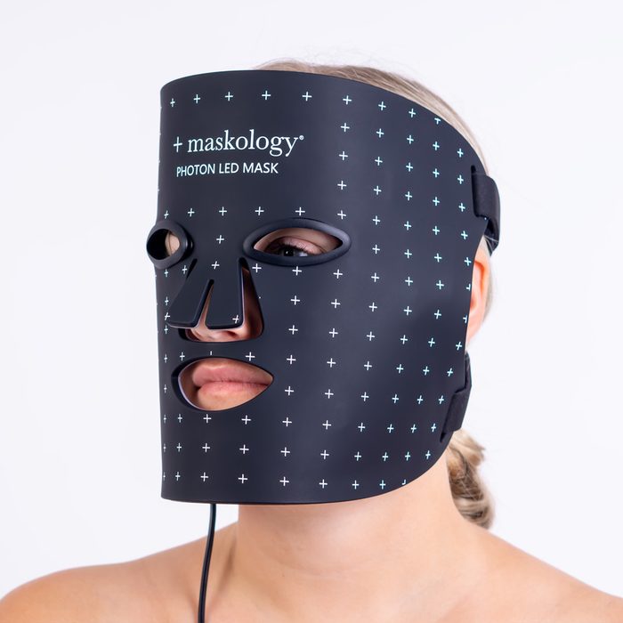 Woman wearing the LED Light Facial Therapy Mask
