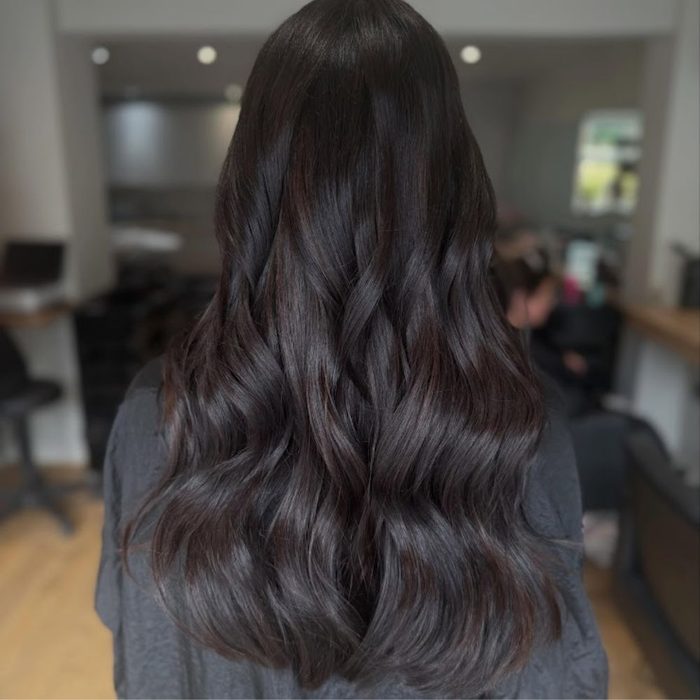 image shows woman with Autumn 2026 Velvet Espresso hair trend