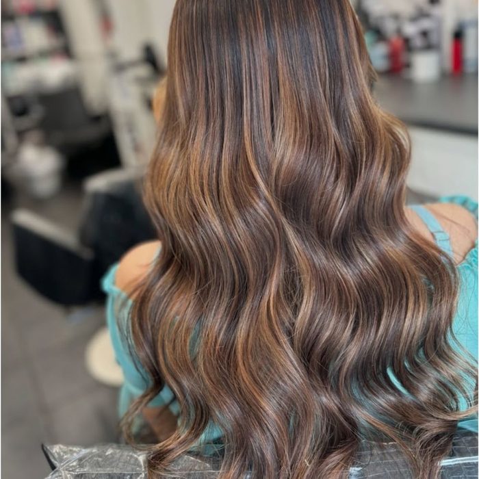 image shows woman with Autumn 2026 Fallayage hair trend
